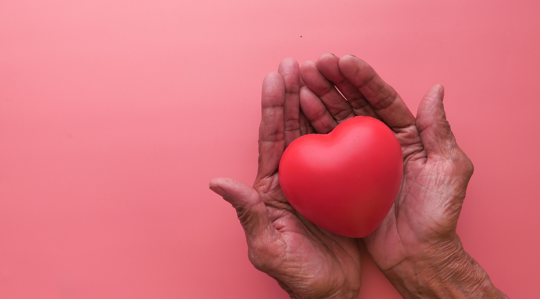 Hands holding a heart symbolizing a caregiver