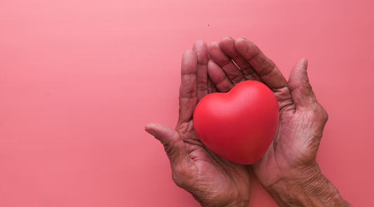 Hands holding a heart symbolizing a caregiver